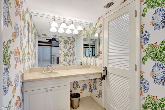 bathroom featuring ceiling fan and vanity