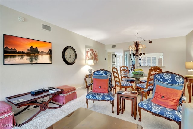 interior space with carpet floors and a chandelier