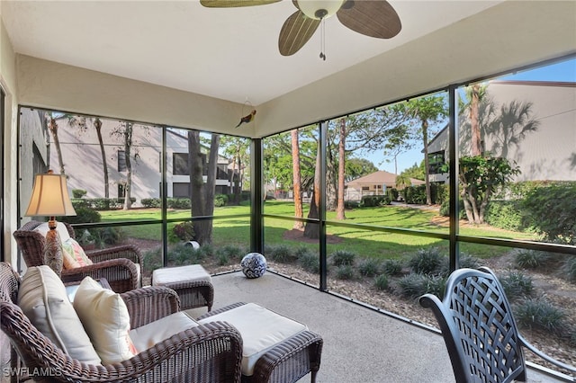 sunroom featuring ceiling fan