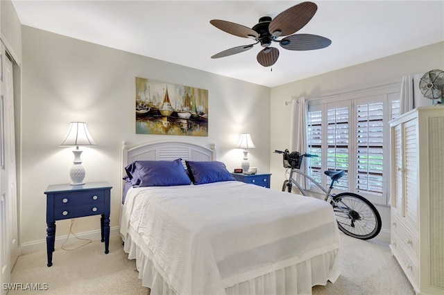 carpeted bedroom featuring ceiling fan