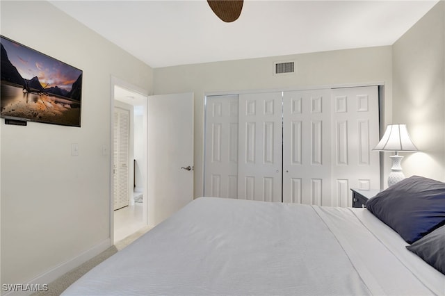 bedroom with a closet and carpet flooring