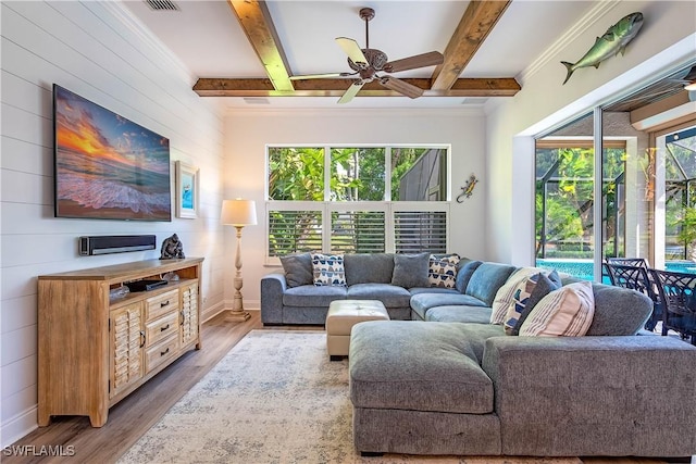 living room with beamed ceiling, ceiling fan, and light hardwood / wood-style floors