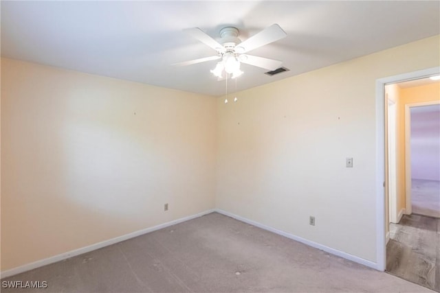 empty room with light carpet and ceiling fan