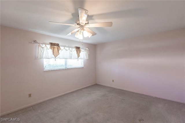 unfurnished room with carpet flooring and ceiling fan