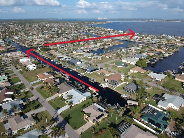 birds eye view of property featuring a water view