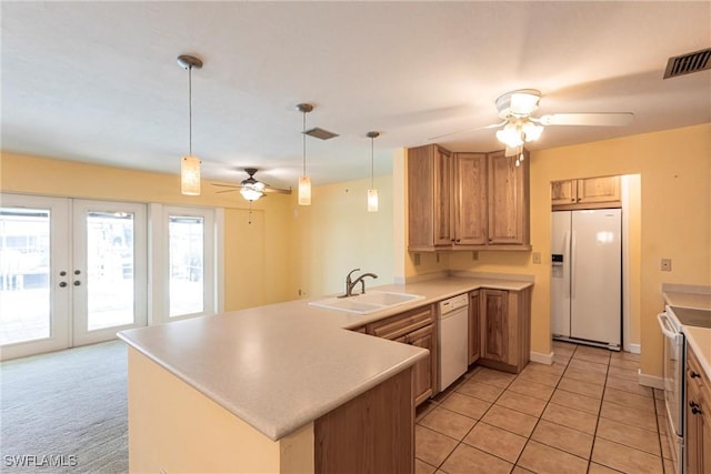 kitchen with sink, ceiling fan, kitchen peninsula, white appliances, and french doors