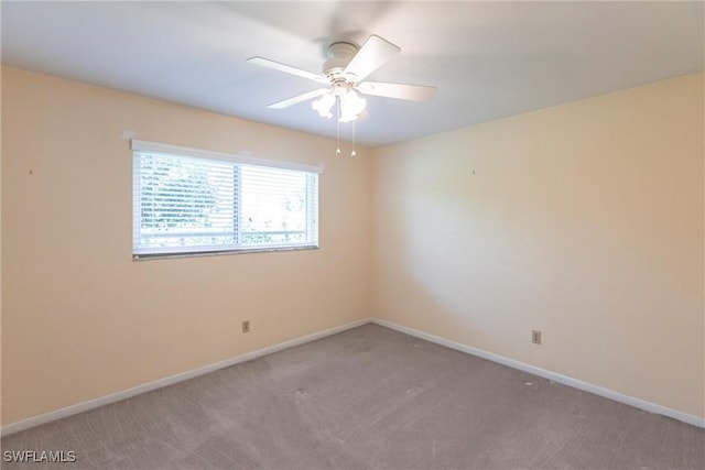 unfurnished room with carpet and ceiling fan