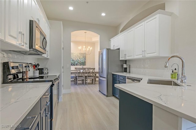 10090 Valiant Ct Unit 202, Miromar Lakes, FL 33913 - kitchen with a sink, white cabinetry, and appliances with stainless steel finishes