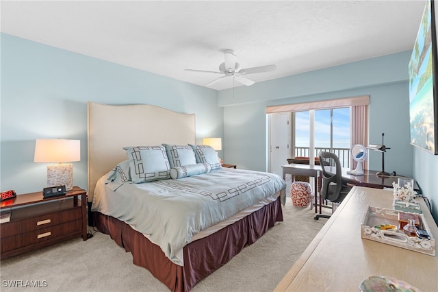 bedroom with light carpet, access to exterior, and ceiling fan