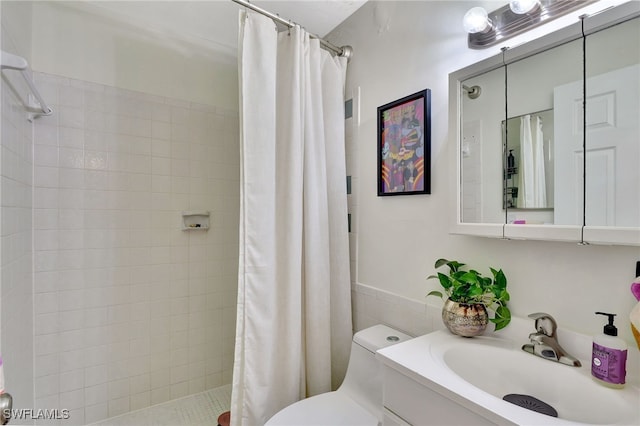 bathroom featuring vanity, toilet, and a shower with shower curtain