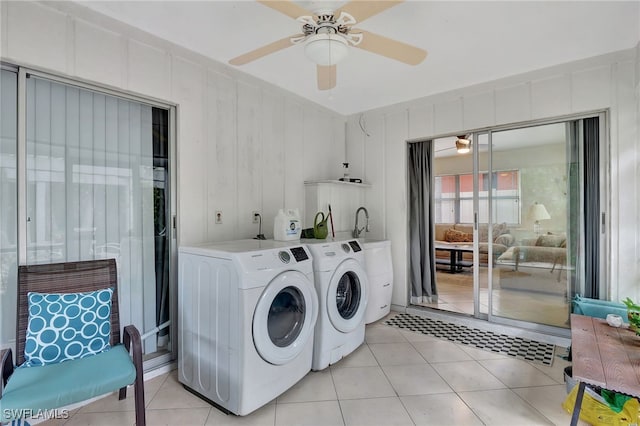 laundry area with light tile patterned flooring, ceiling fan, and washing machine and dryer