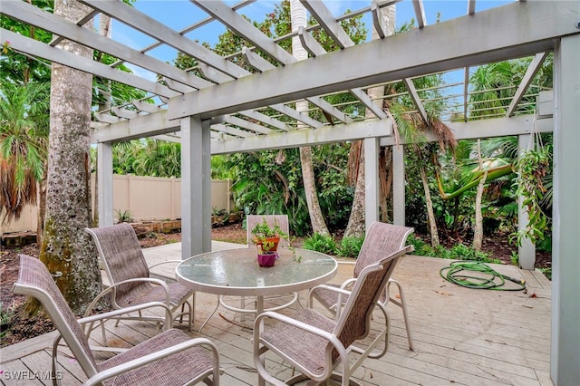 view of patio featuring a wooden deck and a pergola