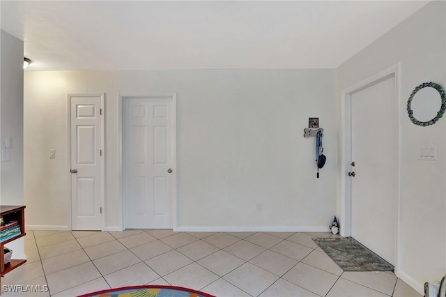 foyer entrance featuring light tile patterned floors