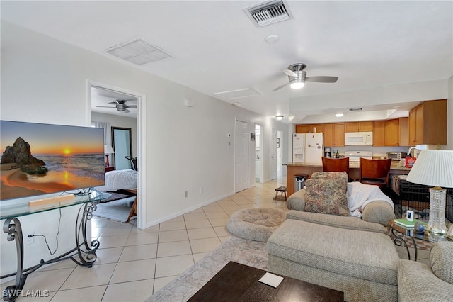 tiled living room with ceiling fan