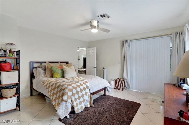 tiled bedroom with ceiling fan