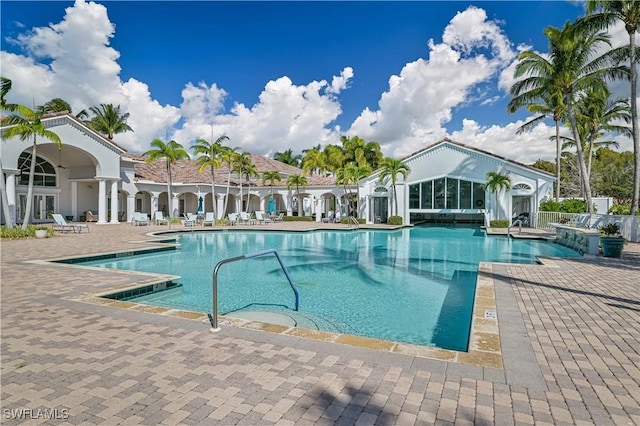 20037 Serene Meadow Ln, Estero, FL 33928 - community pool featuring a patio and french doors