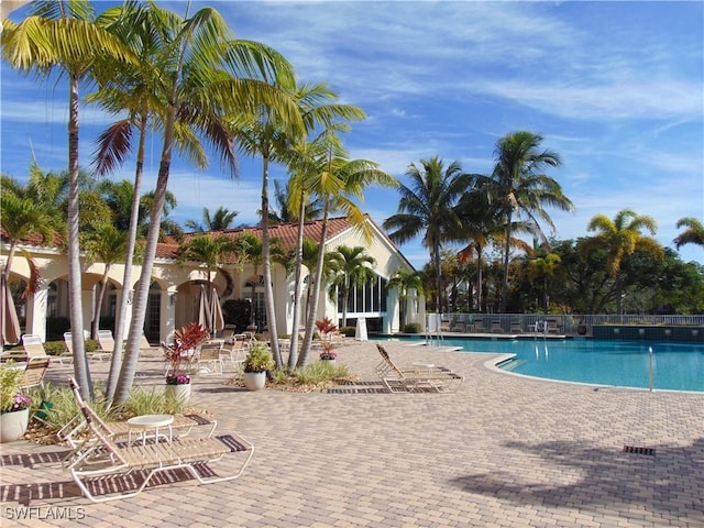 20037 Serene Meadow Ln, Estero, FL 33928 - community pool with a patio