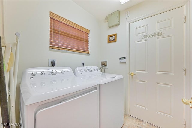 20037 Serene Meadow Ln, Estero, FL 33928 - laundry area with washing machine and clothes dryer and light tile patterned floors