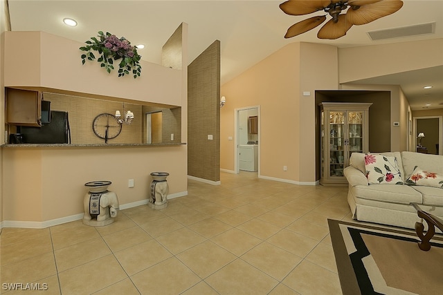 20037 Serene Meadow Ln, Estero, FL 33928 - living room with washer / clothes dryer, light tile patterned floors, vaulted ceiling, a ceiling fan, and recessed lighting