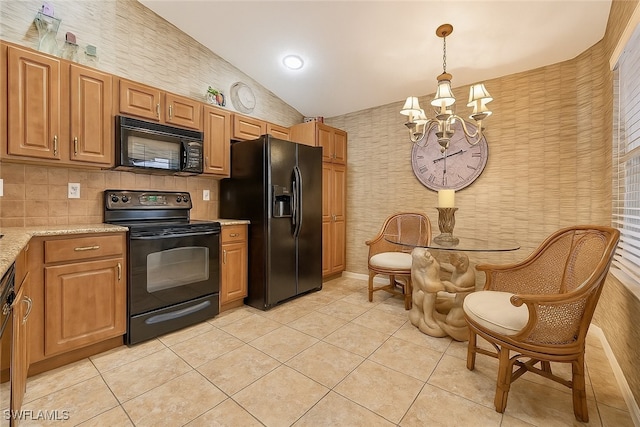 20037 Serene Meadow Ln, Estero, FL 33928 - kitchen with black appliances, a chandelier, wallpapered walls, light tile patterned floors, and vaulted ceiling