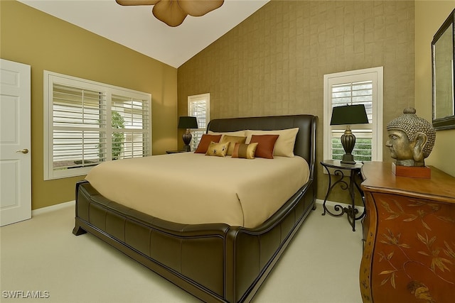 20037 Serene Meadow Ln, Estero, FL 33928 - carpeted bedroom featuring vaulted ceiling, multiple windows, and a ceiling fan