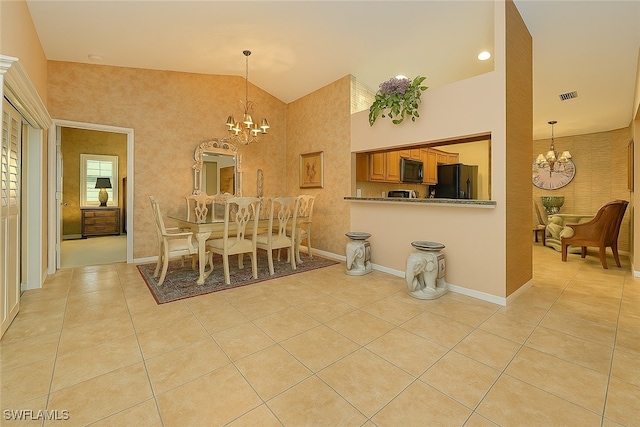 20037 Serene Meadow Ln, Estero, FL 33928 - dining room featuring a chandelier, light tile patterned floors, and vaulted ceiling
