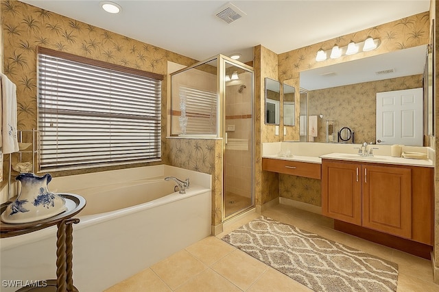 20037 Serene Meadow Ln, Estero, FL 33928 - full bath with wallpapered walls, a garden tub, tile patterned flooring, vanity, and a stall shower