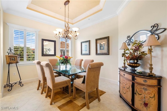 dining room featuring a raised ceiling, crown molding, light tile patterned floors, and a notable chandelier