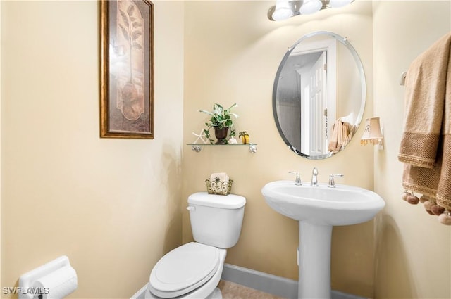 bathroom featuring sink and toilet