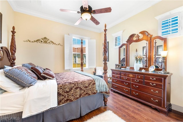 bedroom featuring ceiling fan, ornamental molding, and hardwood / wood-style floors