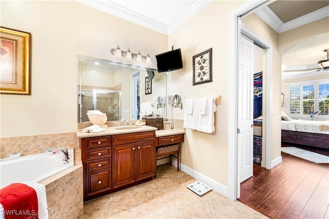 bathroom with crown molding, ceiling fan, vanity, and independent shower and bath