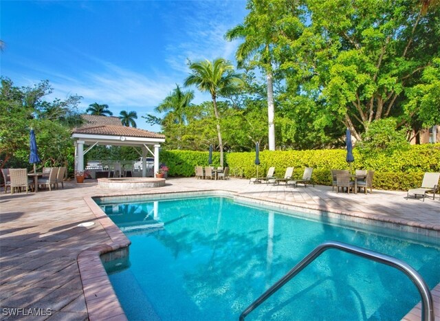 view of pool featuring a gazebo and a patio area