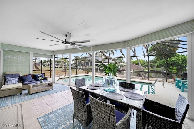 sunroom / solarium featuring a pool and ceiling fan