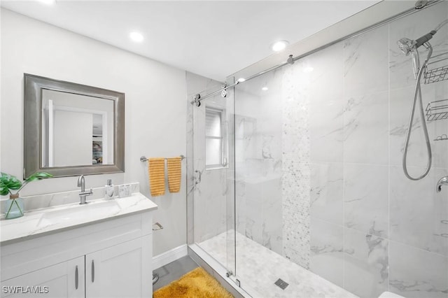 bathroom featuring vanity and an enclosed shower