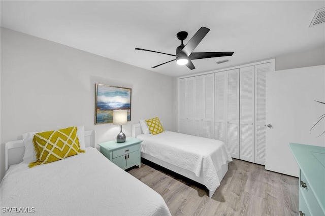 bedroom featuring a closet, ceiling fan, and light hardwood / wood-style flooring