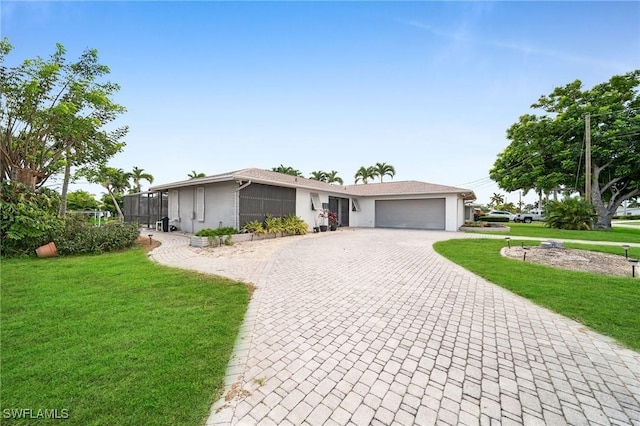 view of front of property featuring a garage and a front yard