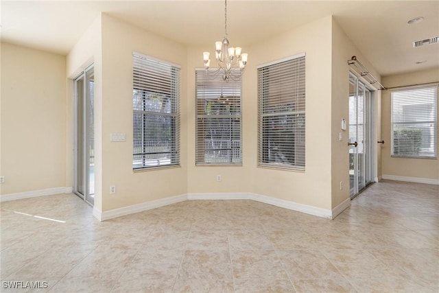 unfurnished dining area featuring visible vents, tile patterned floors, baseboards, and a notable chandelier