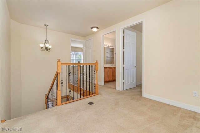 10188 Mimosa Silk Dr, Fort Myers, FL 33913 - spare room featuring baseboards, carpet, and a notable chandelier