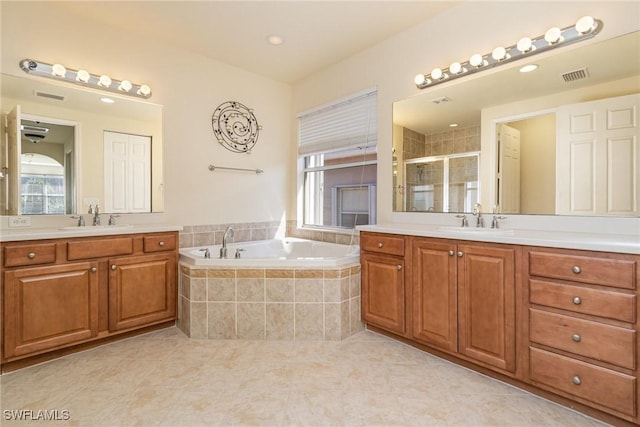 10188 Mimosa Silk Dr, Fort Myers, FL 33913 - bathroom with a sink, a shower stall, a bath, and visible vents