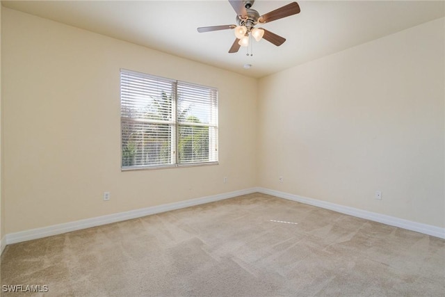 10188 Mimosa Silk Dr, Fort Myers, FL 33913 - spare room featuring baseboards, ceiling fan, and light carpet
