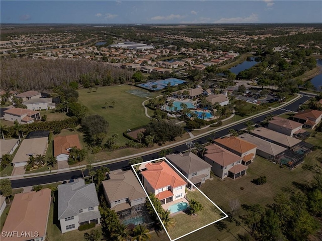 bird's eye view with a residential view and a water view