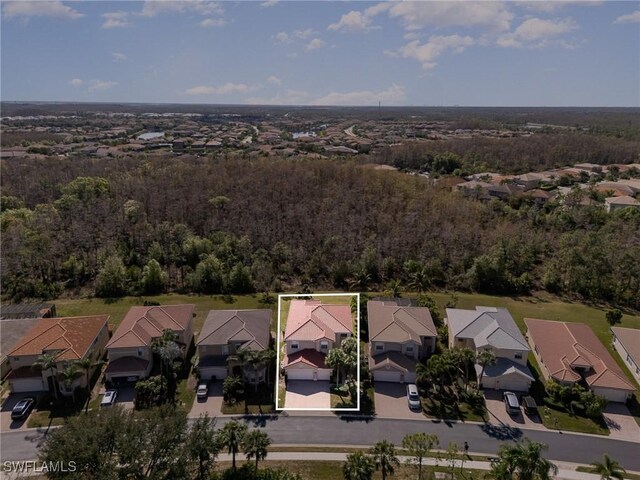 aerial view with a forest view and a residential view
