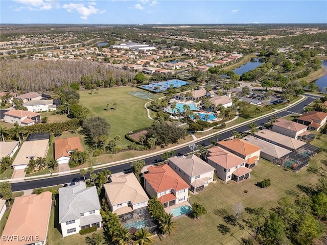 bird's eye view featuring a residential view and a water view