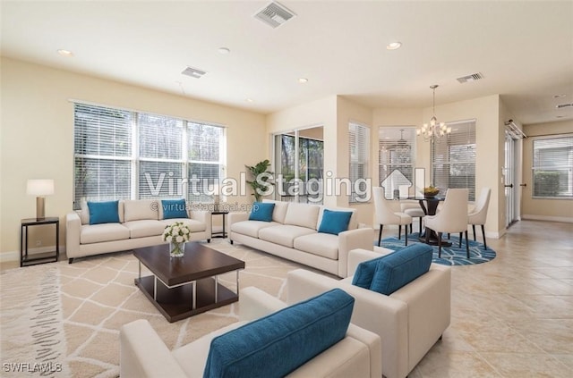 10188 Mimosa Silk Dr, Fort Myers, FL 33913 - living area with baseboards, visible vents, plenty of natural light, and an inviting chandelier