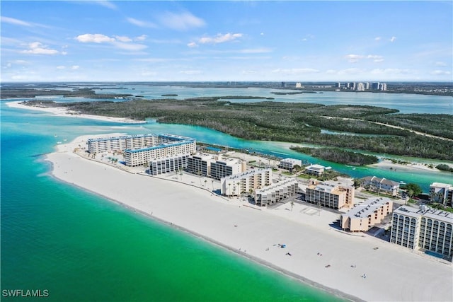 drone / aerial view with a water view and a view of the beach