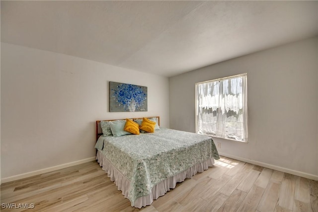 bedroom featuring light wood-type flooring