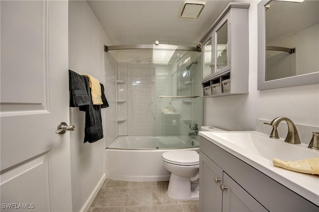 full bathroom with bath / shower combo with glass door, vanity, and toilet