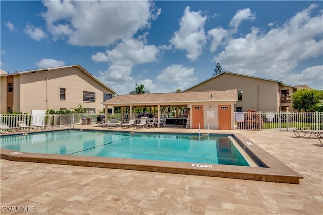 view of swimming pool featuring a patio