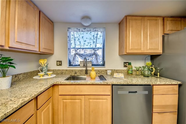 kitchen with sink, stainless steel appliances, light brown cabinetry, and light stone countertops