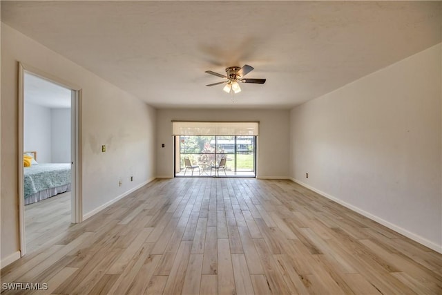 empty room featuring light hardwood / wood-style flooring and ceiling fan